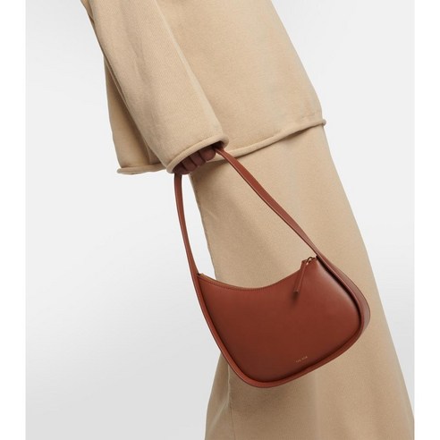 Combining style and functionality, the Half Moon Small leather shoulder bag is a must-have accessory for any fashion enthusiast.