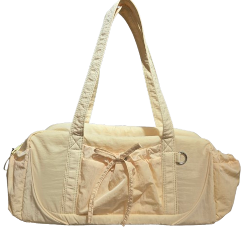 빛나는 일상을 담는 뉴발란스 글로시 리본 더플백