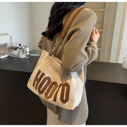 홀매 여성 대학생 클래스 어깨 편지 가방 2024 새로운 유행 대용량 질감 통근 토트 백 도매 스웨이드 가방