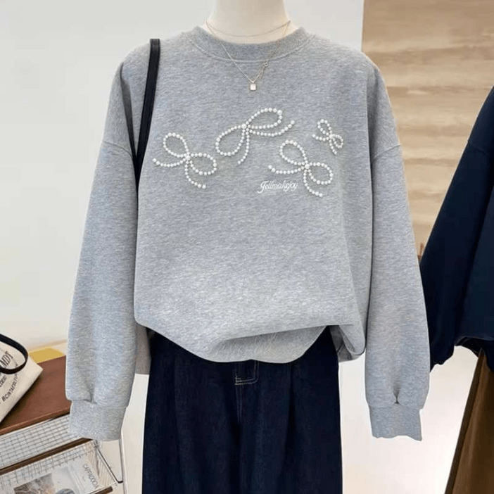 JUSTFEELING 리본 진주장식 고급스러운 긴팔맨투맨 데일리 풀오버 긴팔티 여성의류 봄가을 기본핏 편한 맨투맨 상의